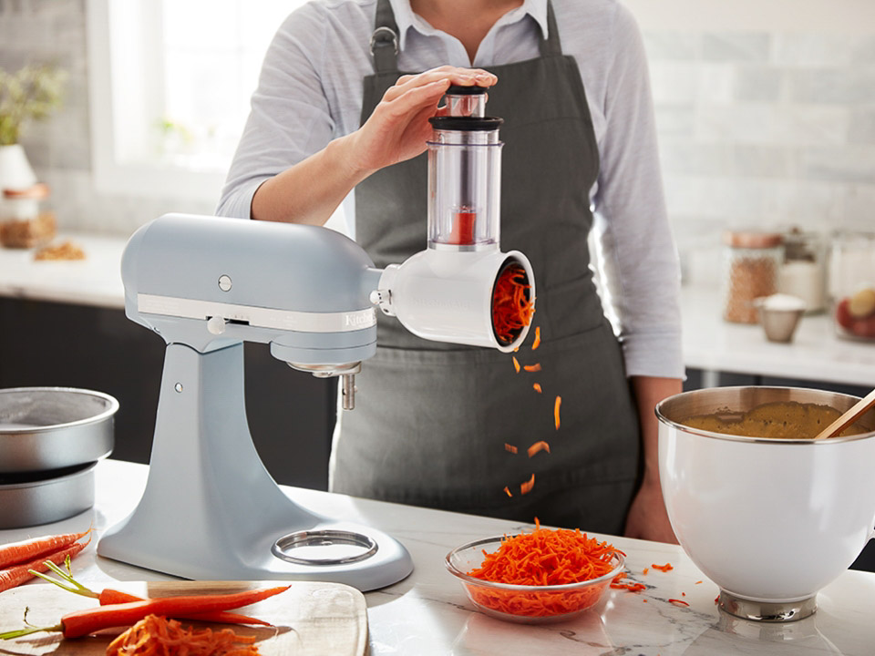 Mixer-attachments-vegetable slicer and shredder with woman using the slicer