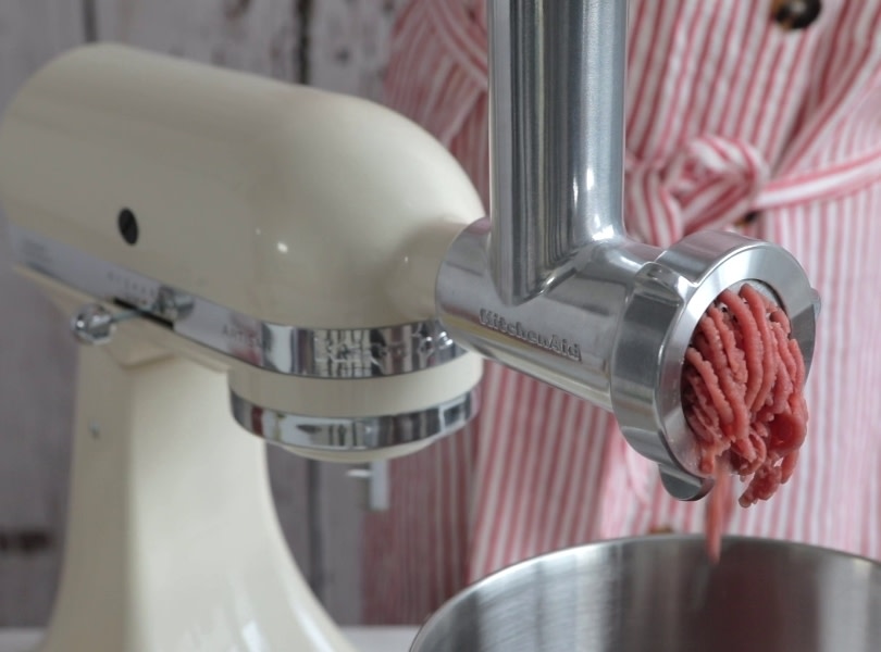 Meat-grinder-on-cream-mixer-grinding-meat