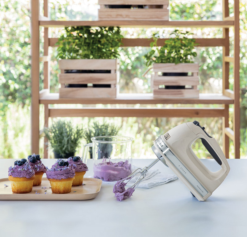 cream-hand-mixer-and-purple-cupcake