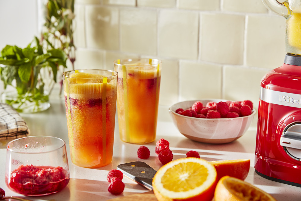 two-glasses-of-fresh-orange-and-raspberries-fruit-juice