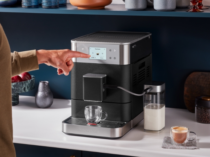 column-content-wrapper-person-choosing-pre-set-recipe-from-touchscreen-of-fully-automatic-espresso-machine