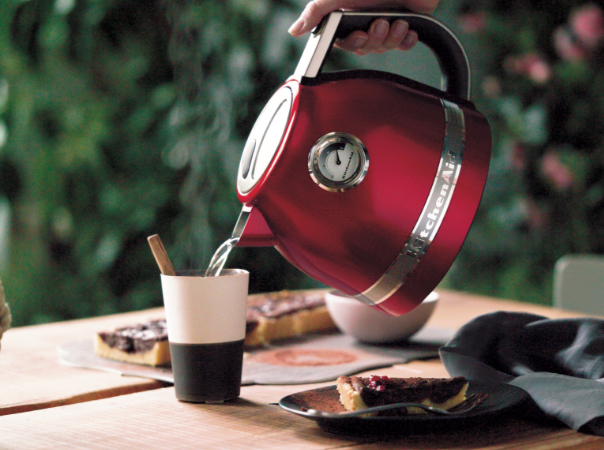 red-kettle-serving-hot-water-in-a-cup