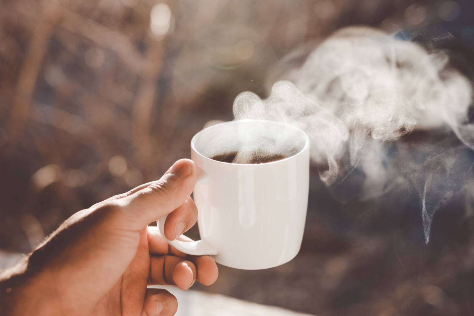 white-cup-of-coffee-in-hand.jpg