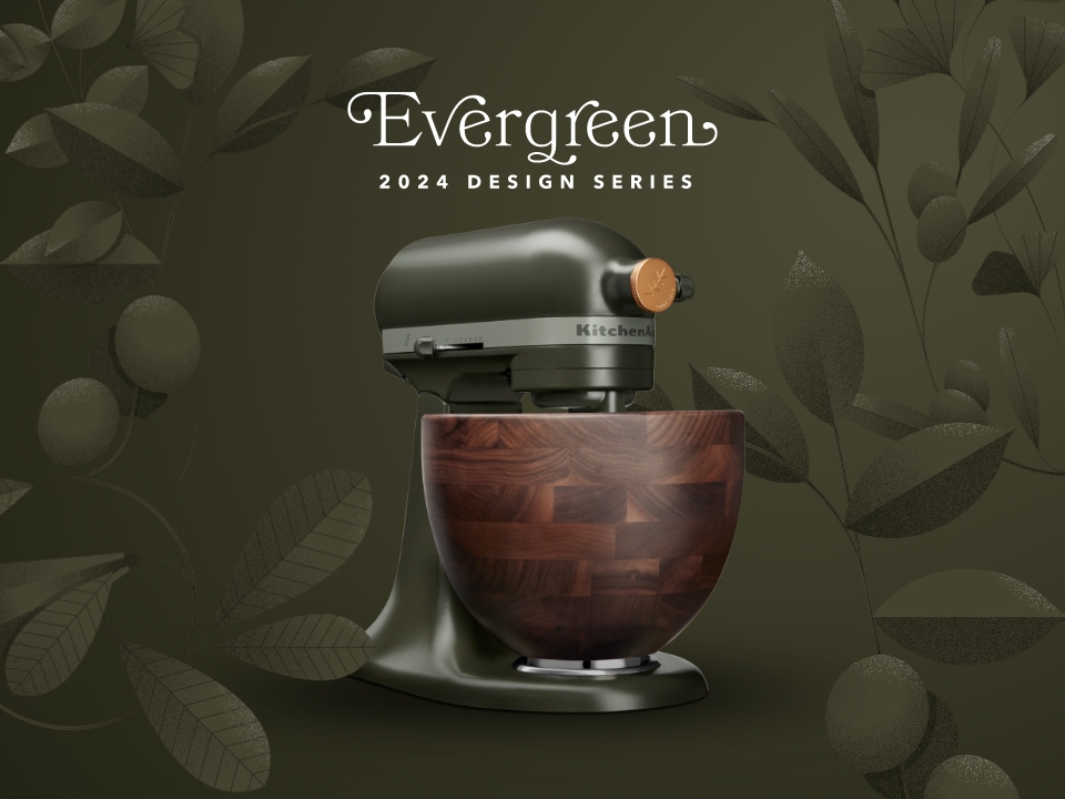 kitchenaid-evergreen-mixer-on-dark-green-background-surrounded-by-leaves