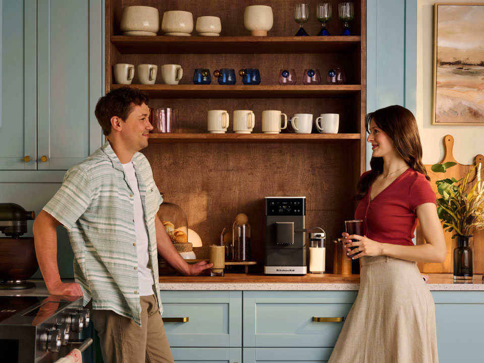 photo-left-right espresso-fully-auto-kf4 couple-enjoying-coffee-made-with-kf4-in-their-small-kitchen