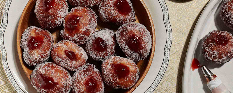 Lemon scented strawberry jam doughnuts