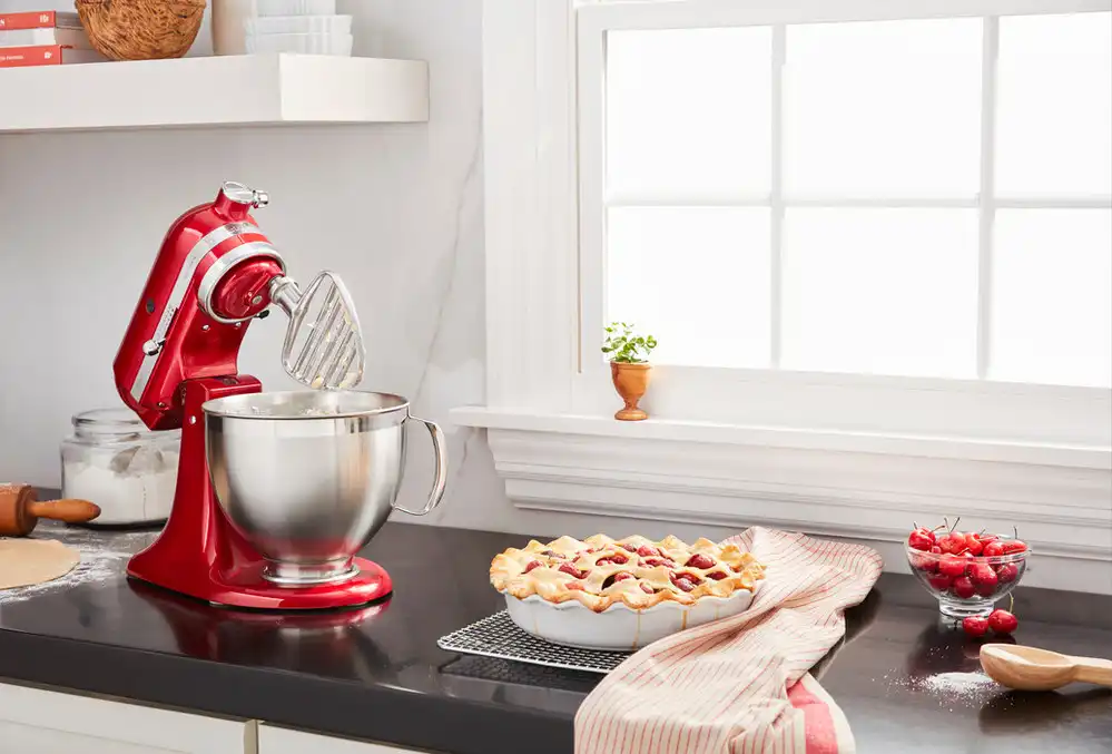 red-stand-mixer-with-pasty-beater-mixing-ingredients-for-a-pie