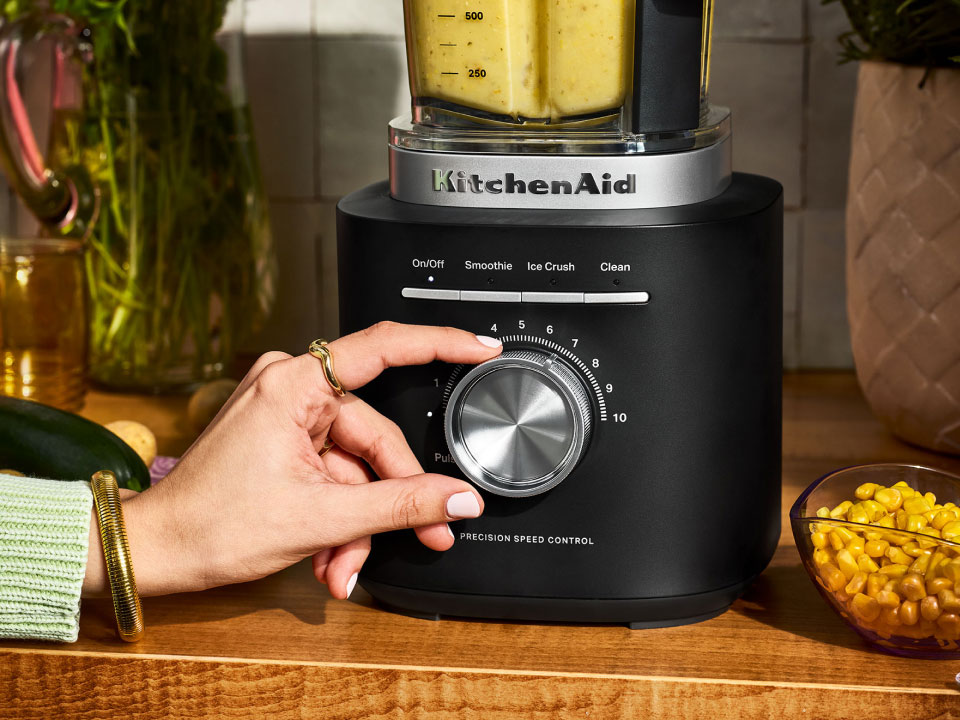 pure-power-blender benefit1 blender-on-countertop-with-user-taking-control