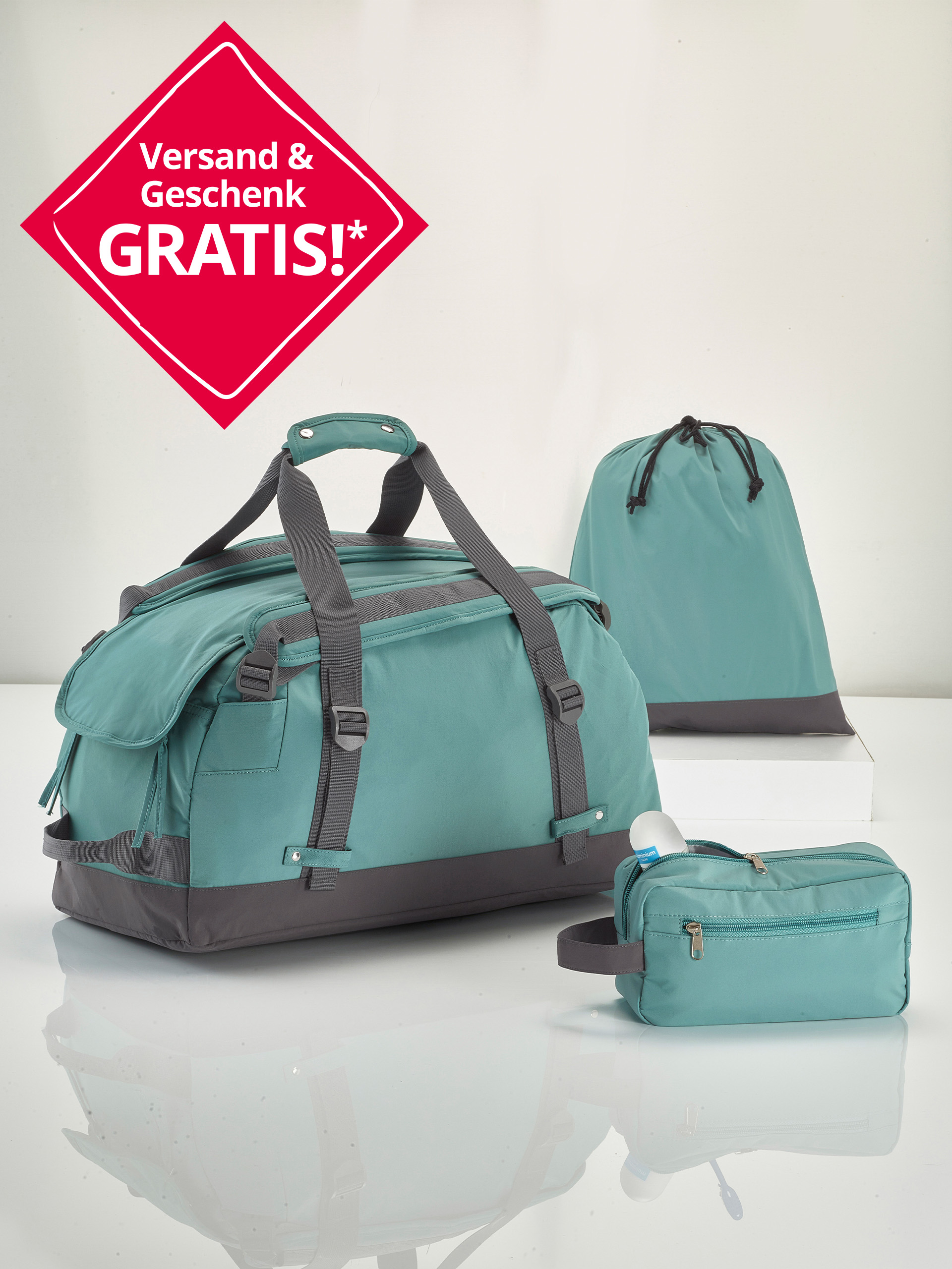 Drei türkisfarbene Taschen in verschiedenen Größen mit grauen Details stehen auf einem weißen Untergrund. Text auf roter Fläche: 'Versand & Geschenk GRATIS!*'.