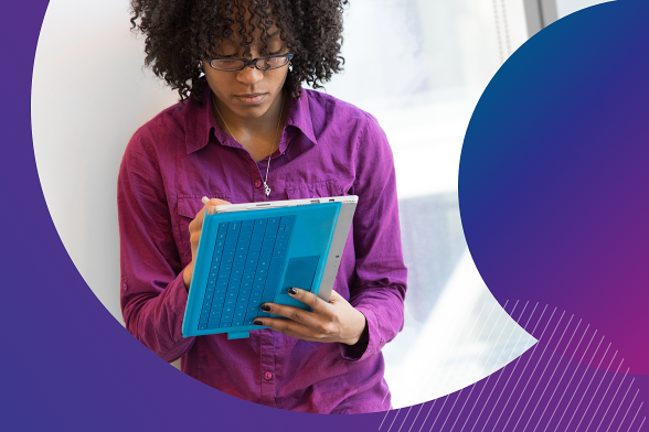 Young woman in a purple shirt holding a tablet