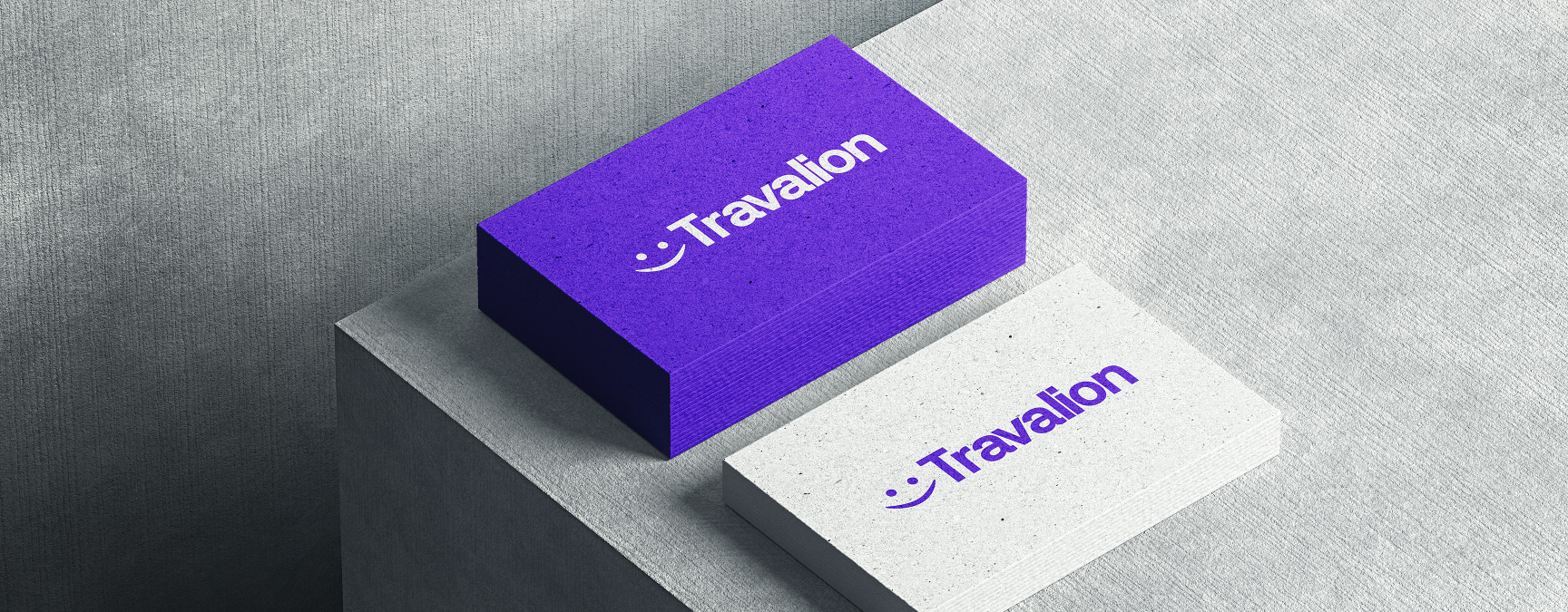 Two business card designs featuring the vibrant Travalion logo, highlighting its cheerful and friendly branding