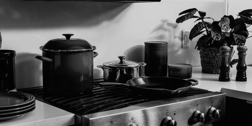 A moody, monochrome kitchen scene.