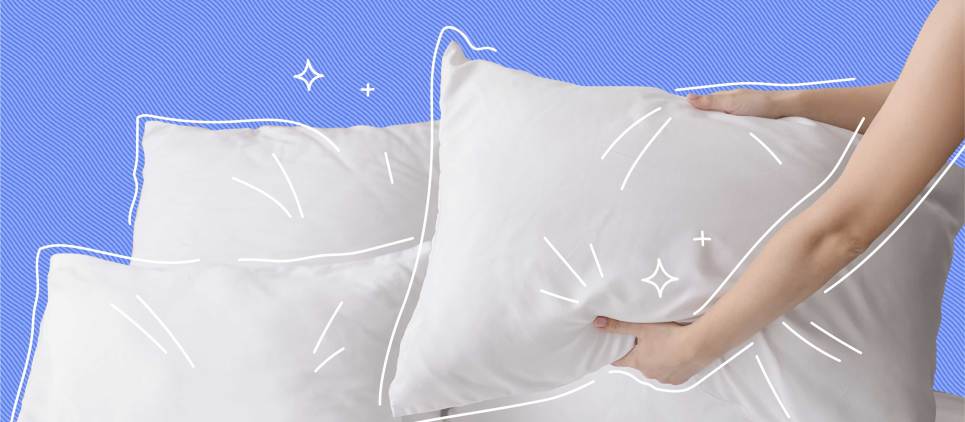 3 white pillow on blue background with hands holding one of pillows 