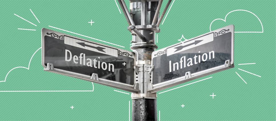 Two signs reading "inflation" and "deflation"  pointing in opposite directions.