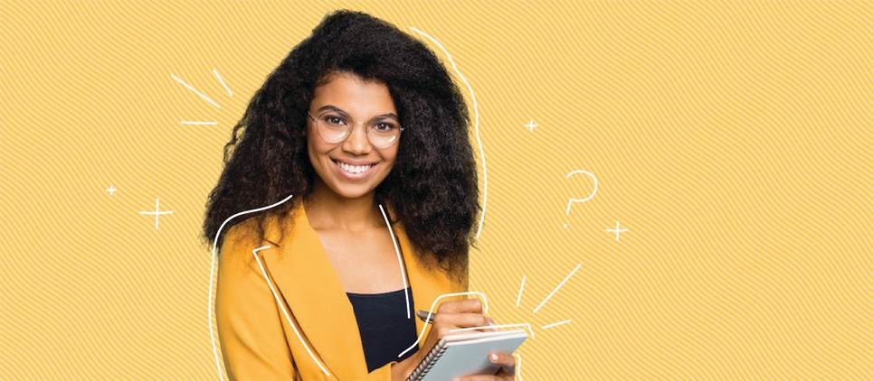 girl with glasses takes notes on yellow background
