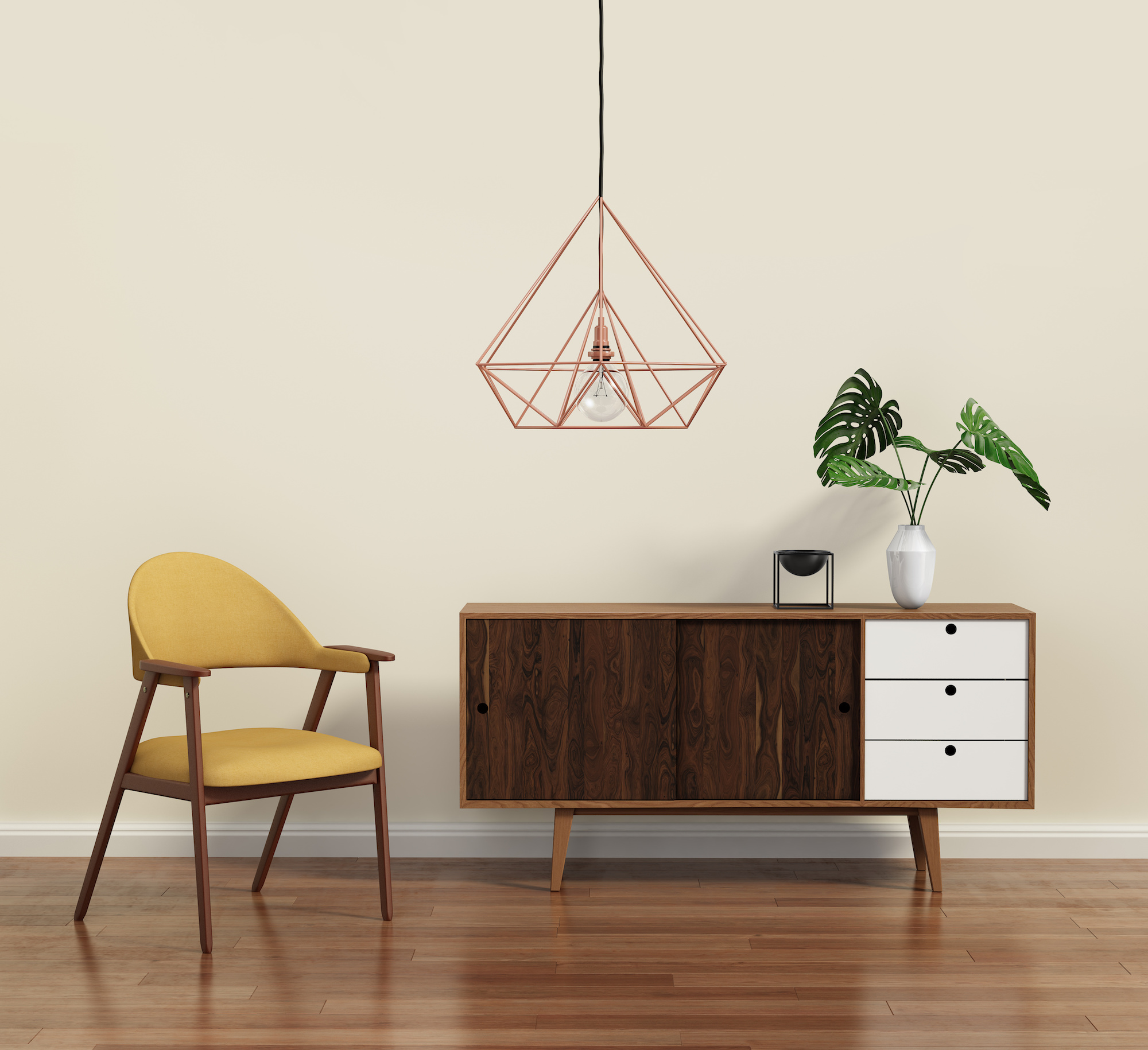 Mid-century modern yellow chair, dark wood and white console and metallic pendulum light fixture. 