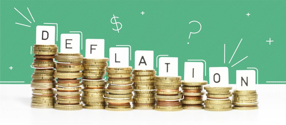 Stacks of coins with letters spelling out "deflation" on top of each stack.