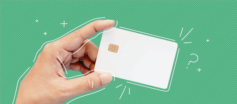 white credit card on green background