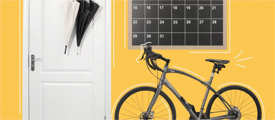 hanging umbrellas, calendar, and bike on yellow background