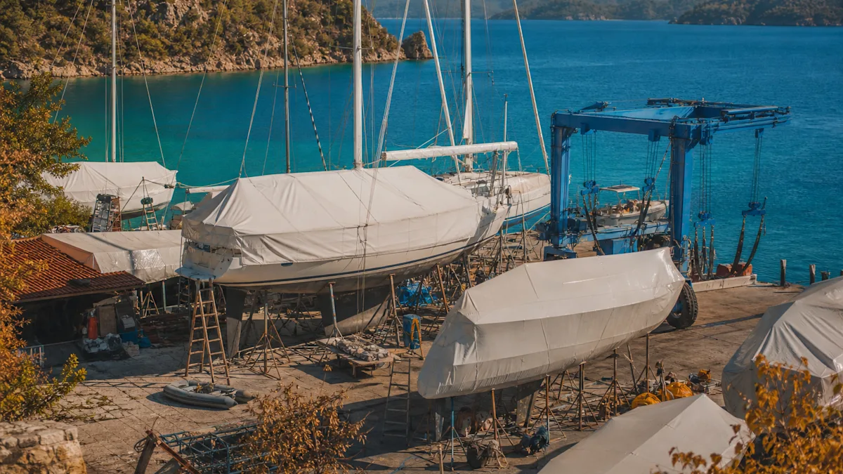 Covered boats on stands and a travel lift in the boatyard