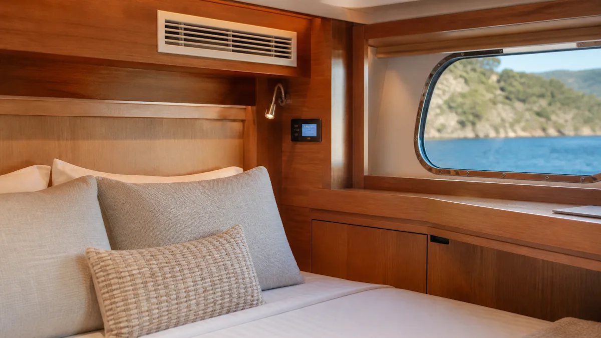 An air-conditioning outlet grille set into the cabin joinery with its control panel alongside