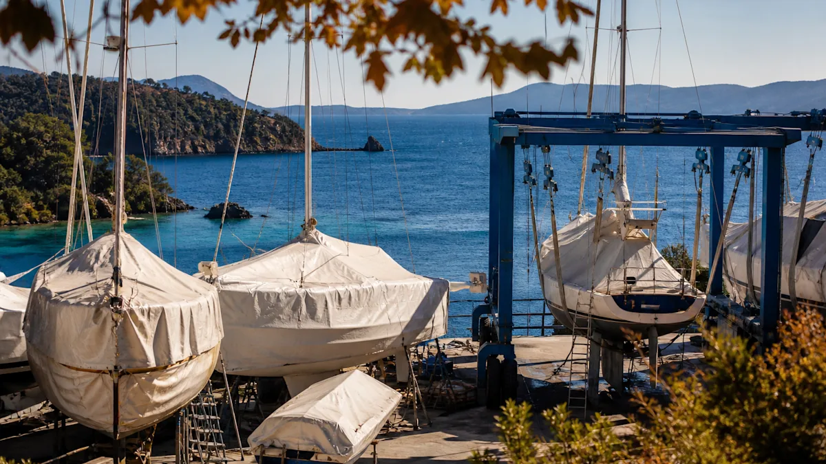 A travel lift and covered boats in the boatyard