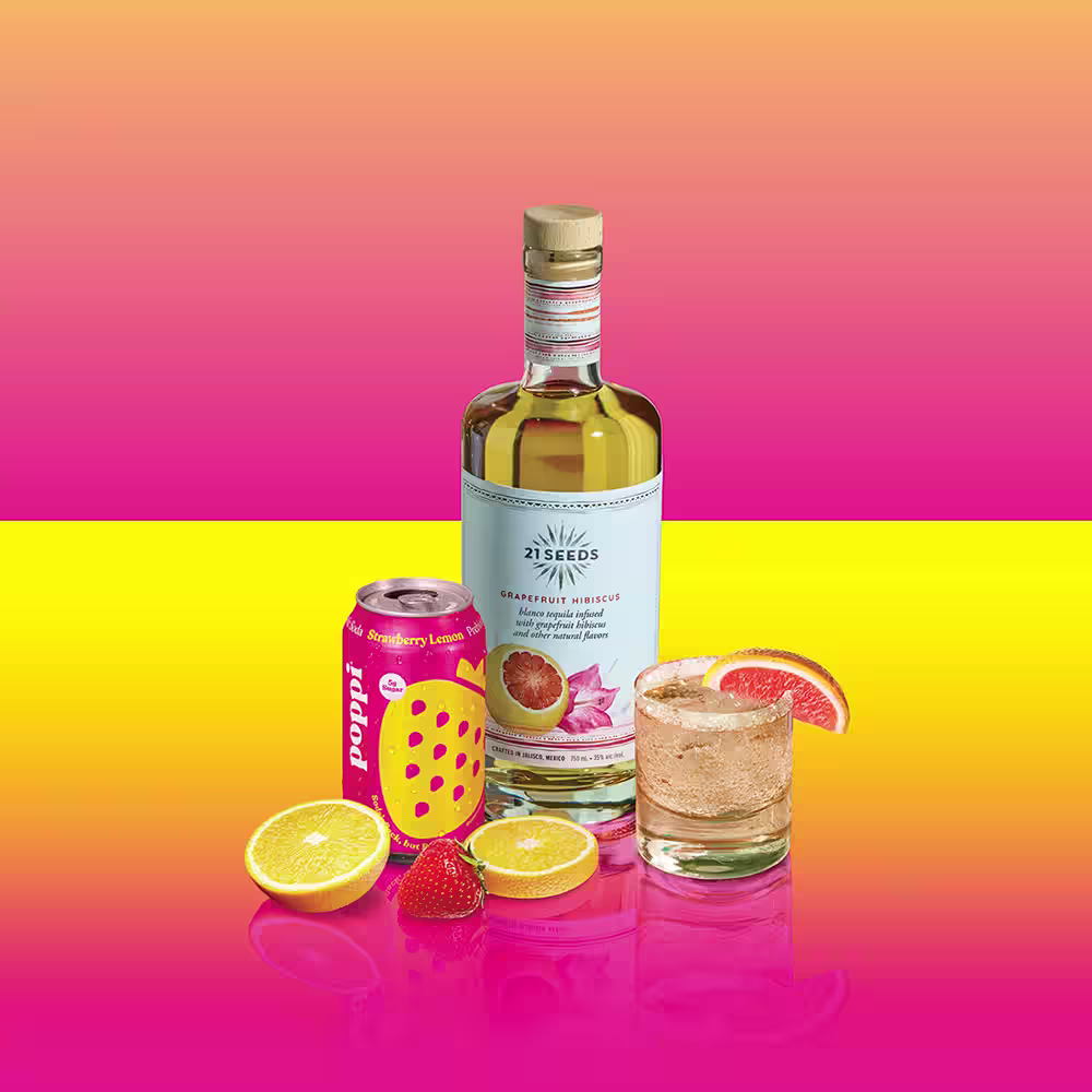 21 Seeds Strawberry Sparkling Margarita bottle lemon slices strawberries and tumbler