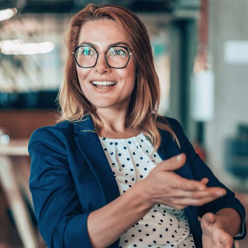 Professional presenting woman with glasses having conversation