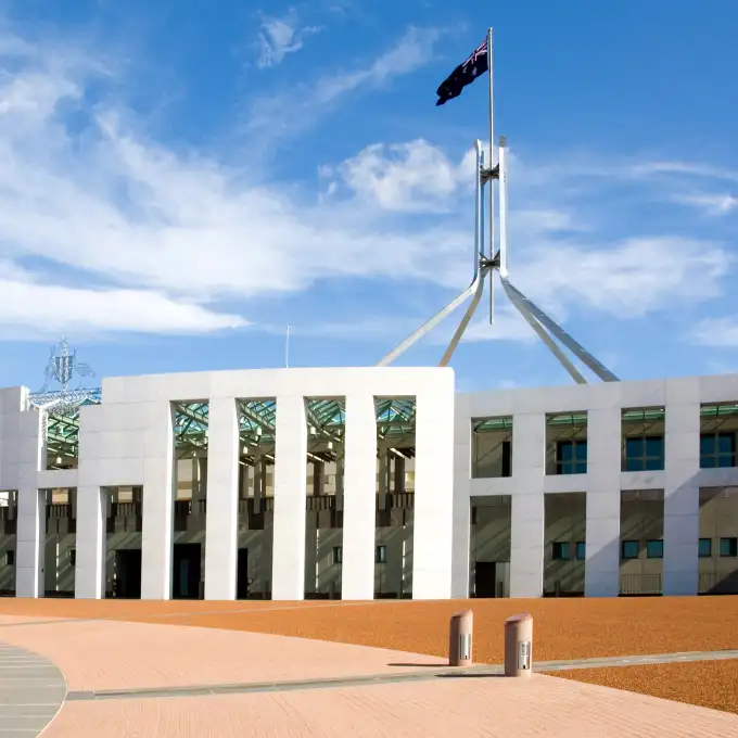 Capitol building with a blue sky with white clouds