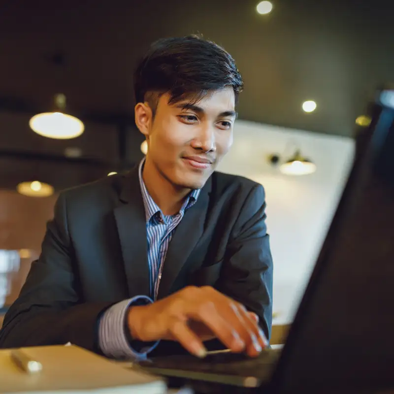 A customer meets with her accountant who uses Docusign in an office