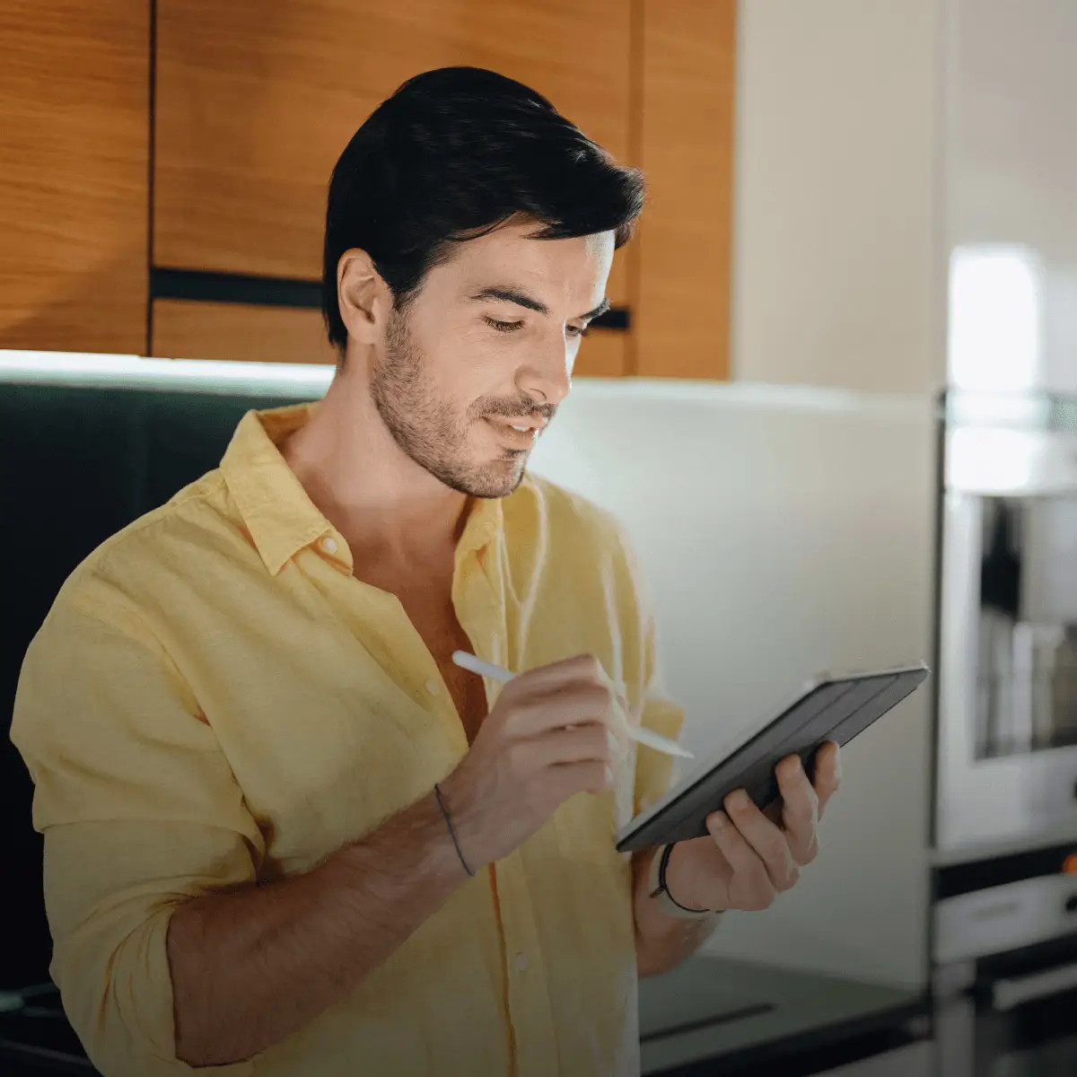 A notification from DocuSign asks a user to sign a Medicaid application form, and an applicant signs the form on a tablet.