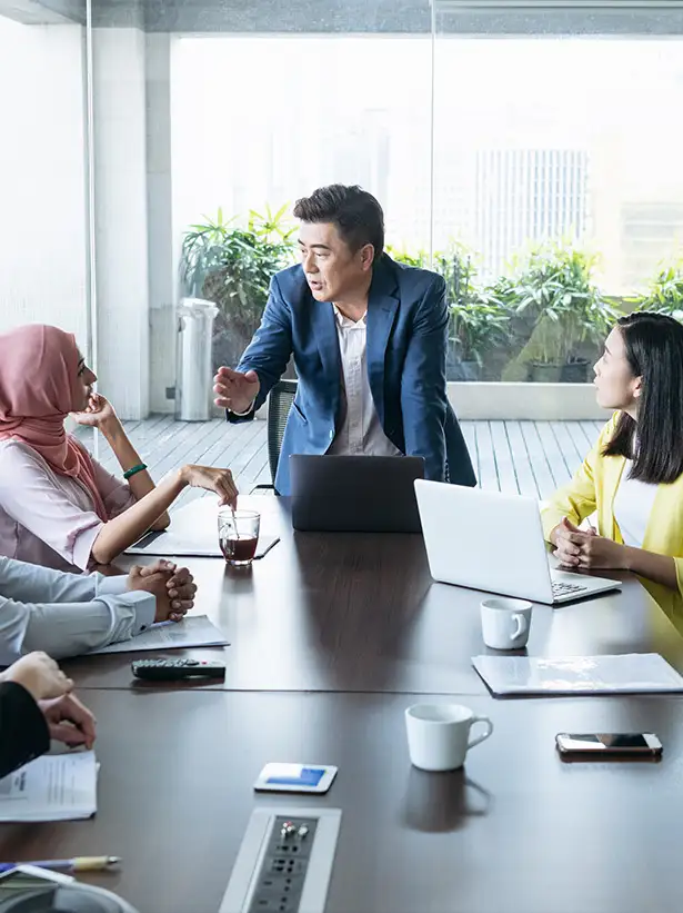 Businessman making presentation in office board room