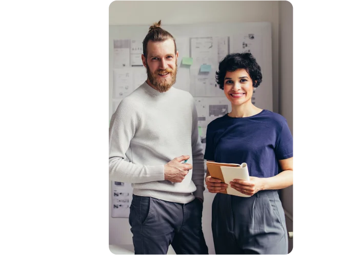 Two people smiling in an office