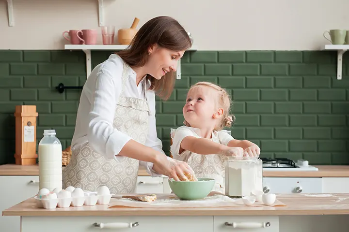 Mum cooking with baby