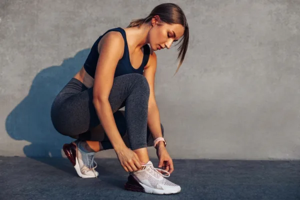 Woman tying up laces