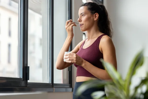 Woman eating yoghurt