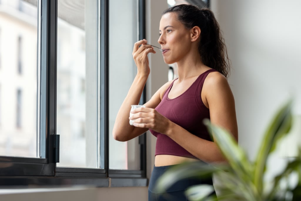 Woman eating yoghurt