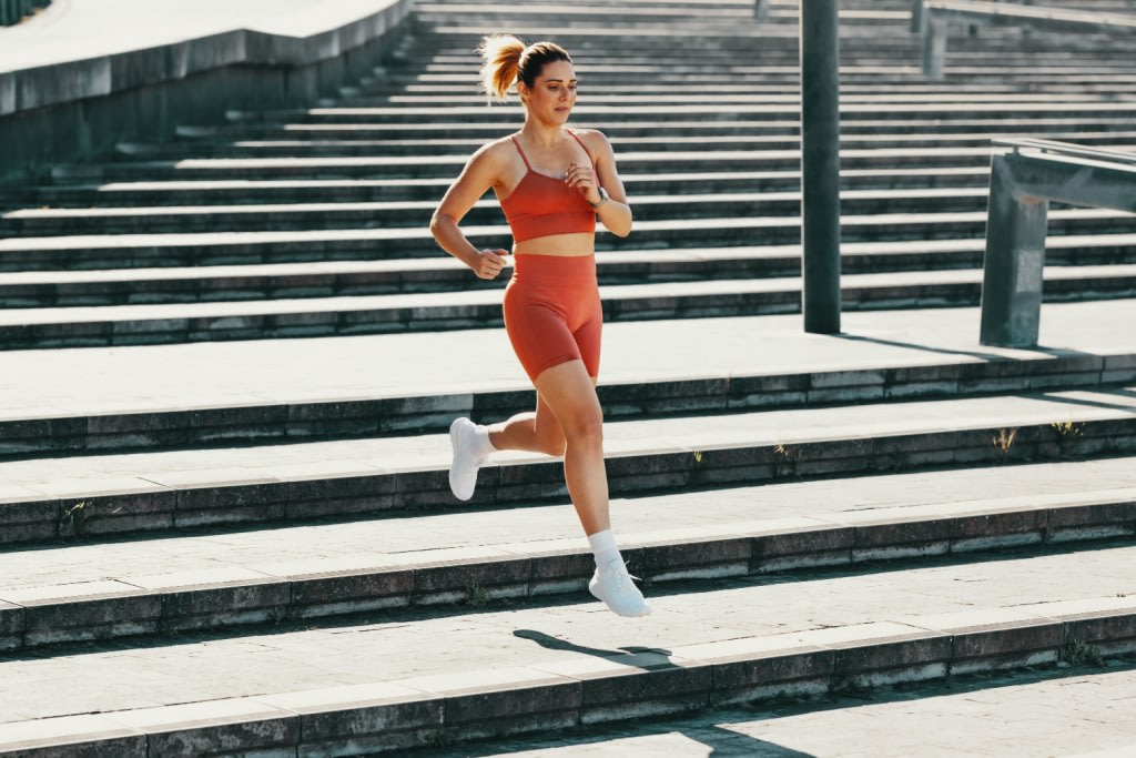 Woman running down stairs