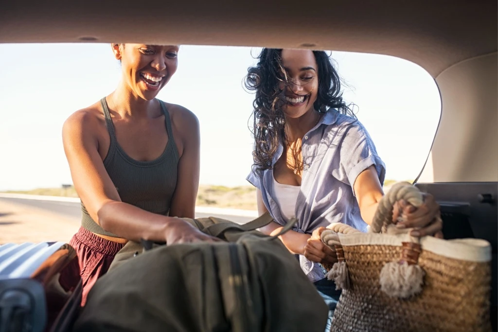 Women packing car