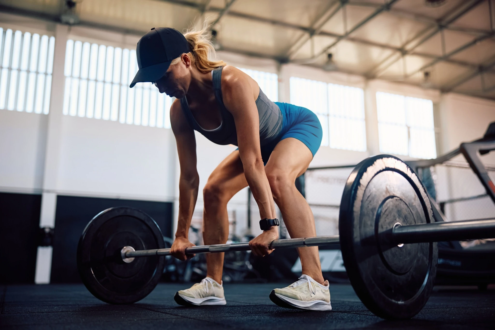 Woman doing barbell deadlift