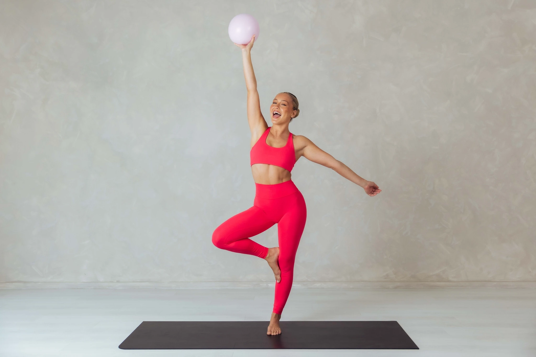 Jetaya smiling with Pilates ball