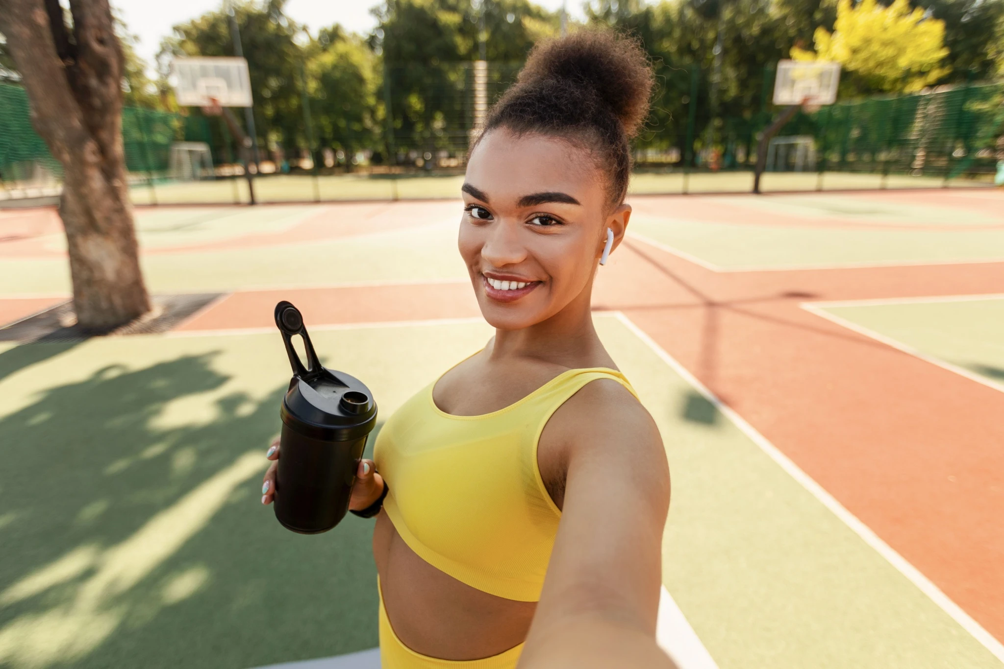 Woman holding shaker bottle