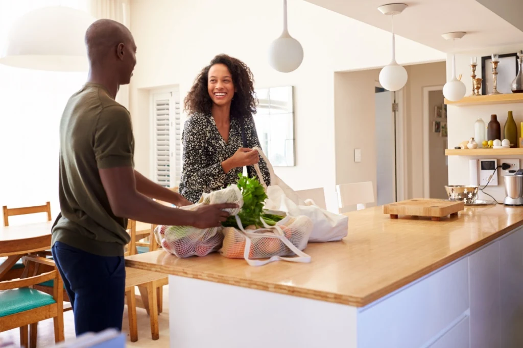 Couple unpacking groceries