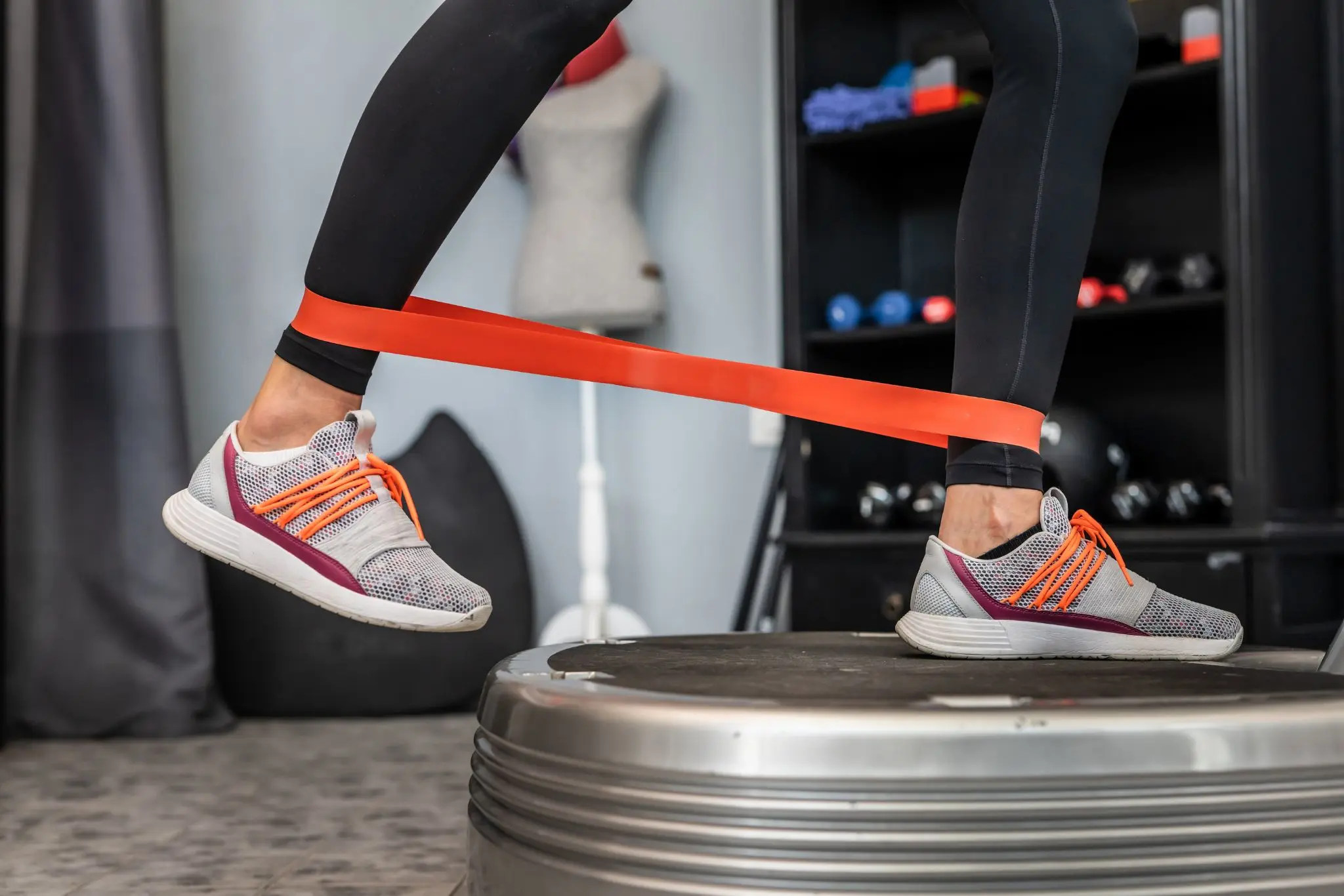 Woman standing on vibration plate