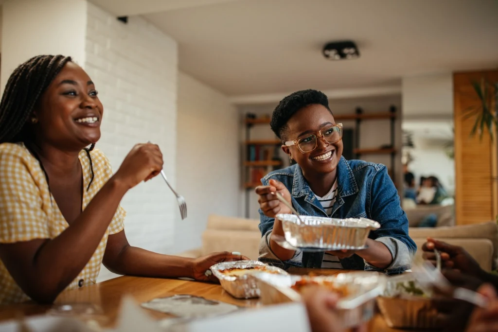 Women eating dinner together at home