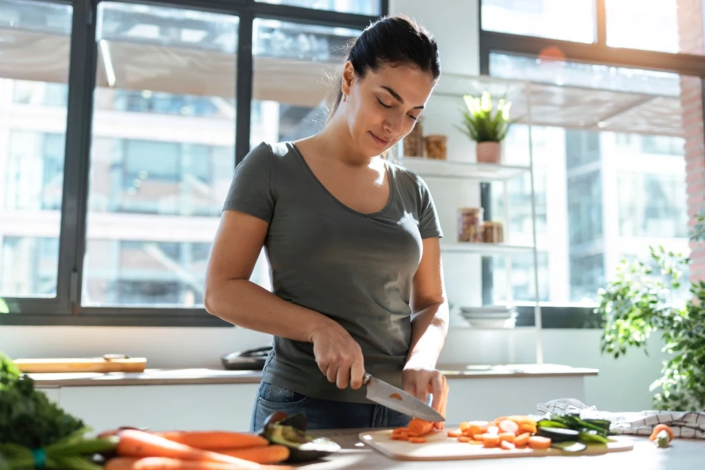 Woman Cutting Vegetables