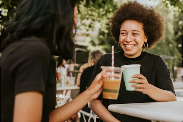 Two women drinking coffee