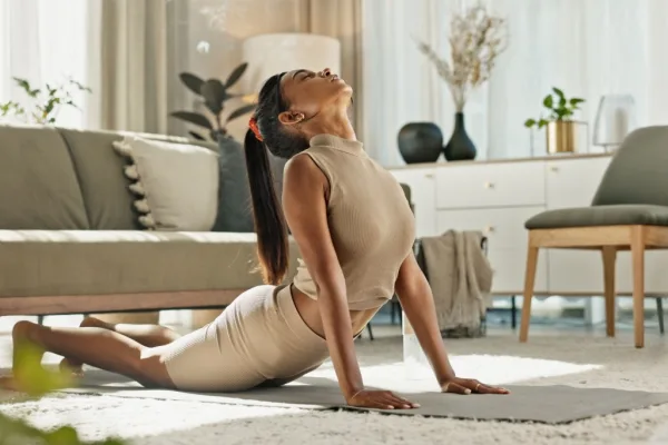 Woman stretching in living room