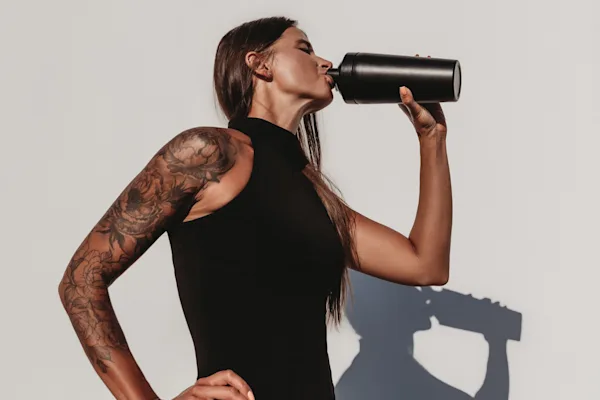 Woman drinking shaker