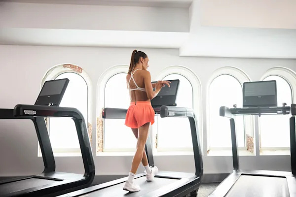 Kayla Itsines walking on treadmill